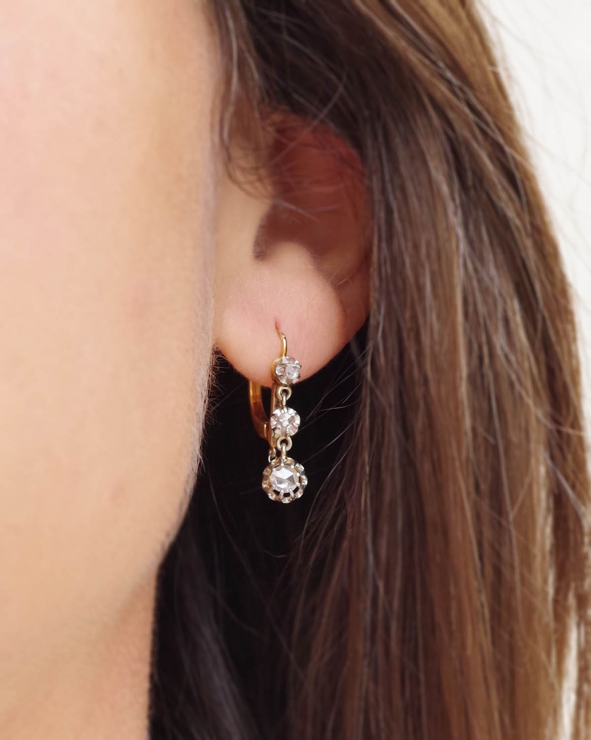 Three diamond earrings