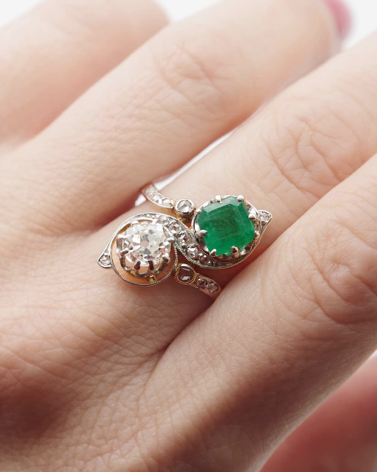 You and me ring with an emerald