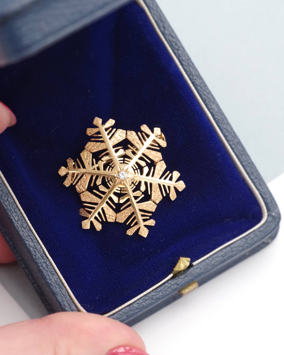 diamond snowflake brooch in gold