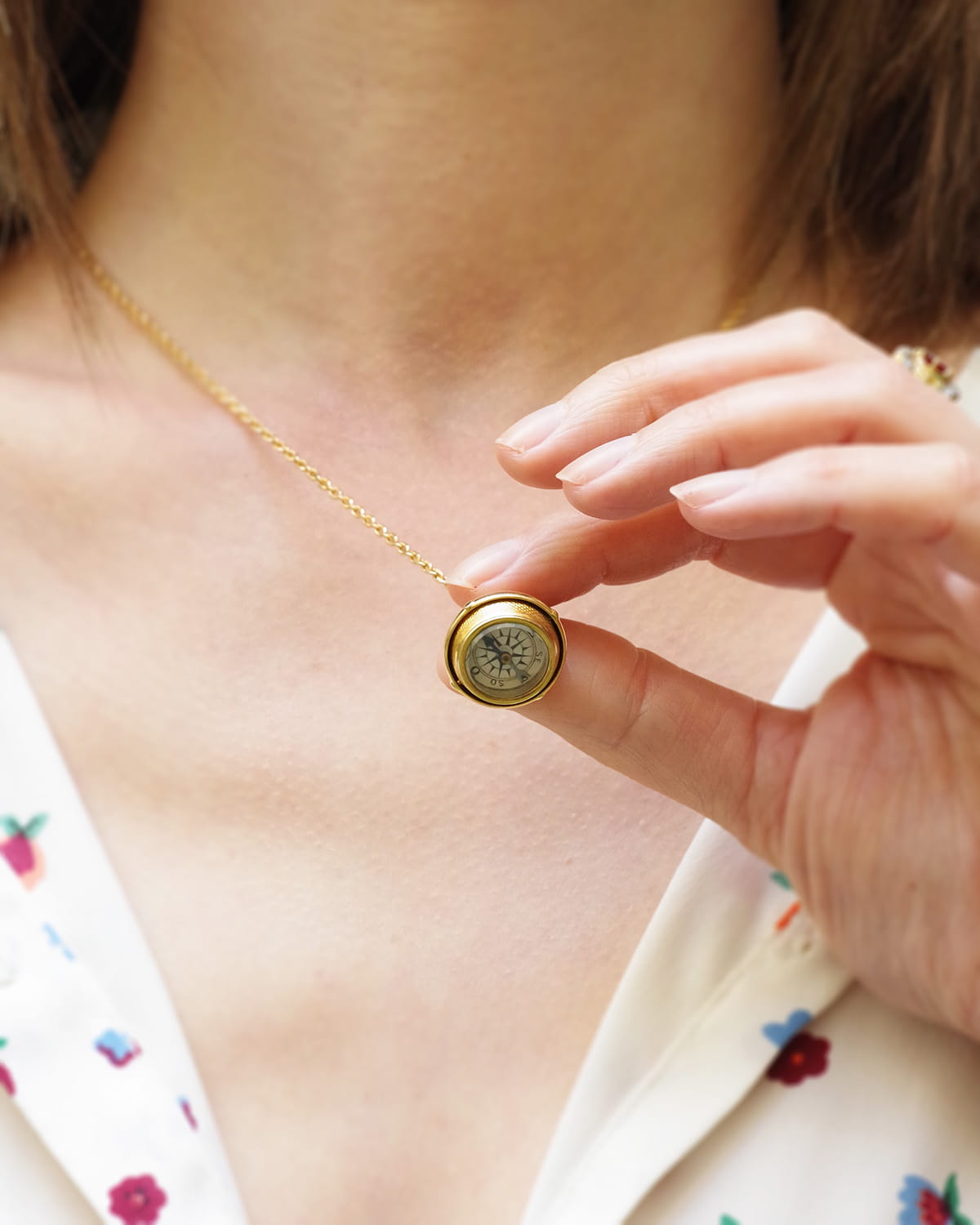 Swivel gold compass pendant