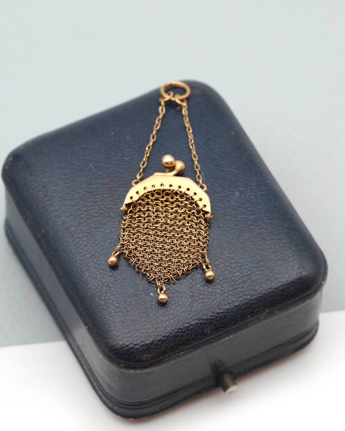 Antique doll purse in gold