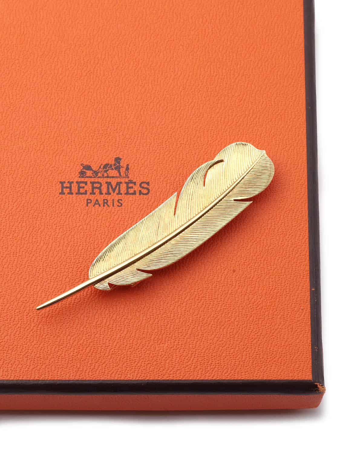 Hermes gold brooch