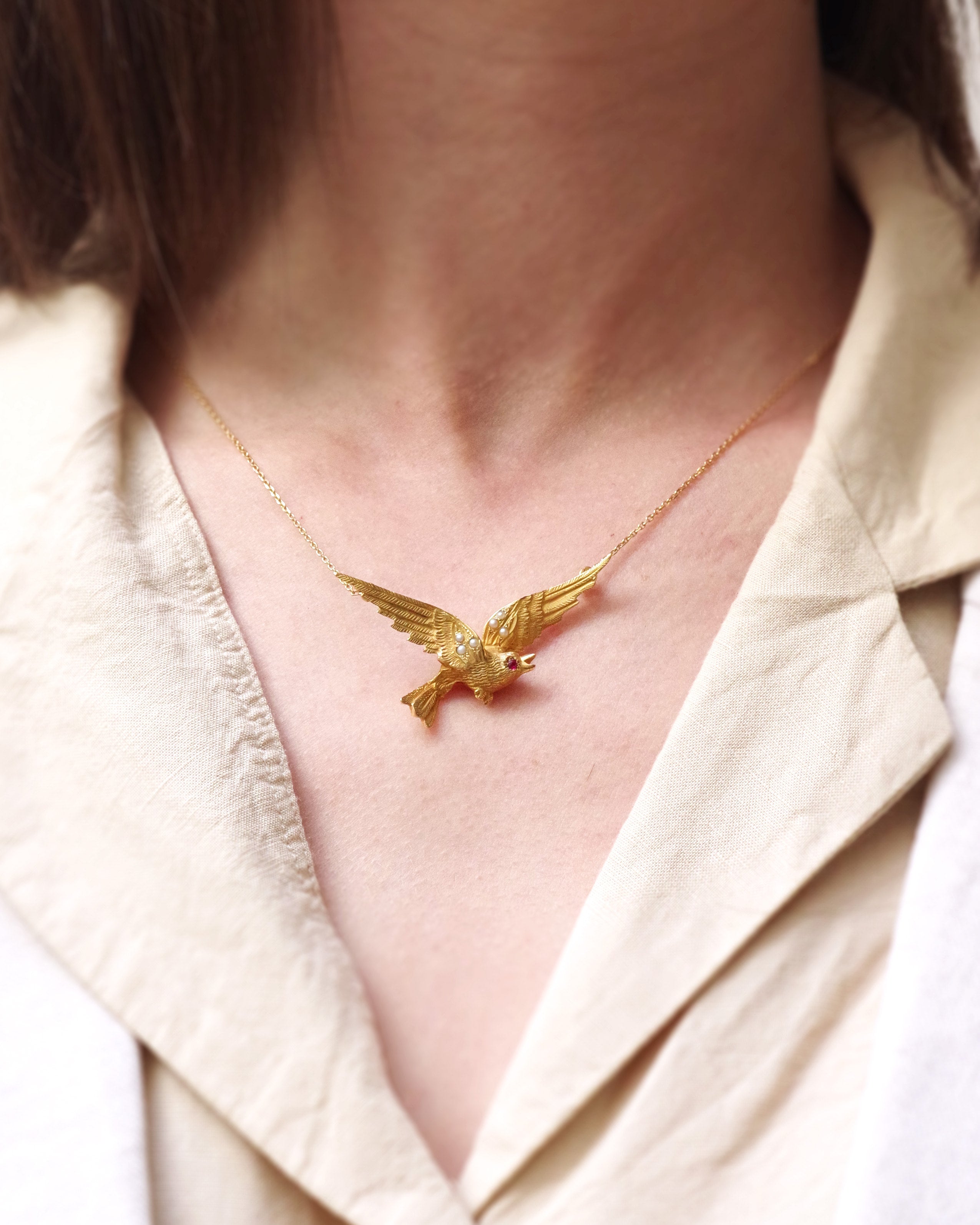 collier pendentif oiseau en or