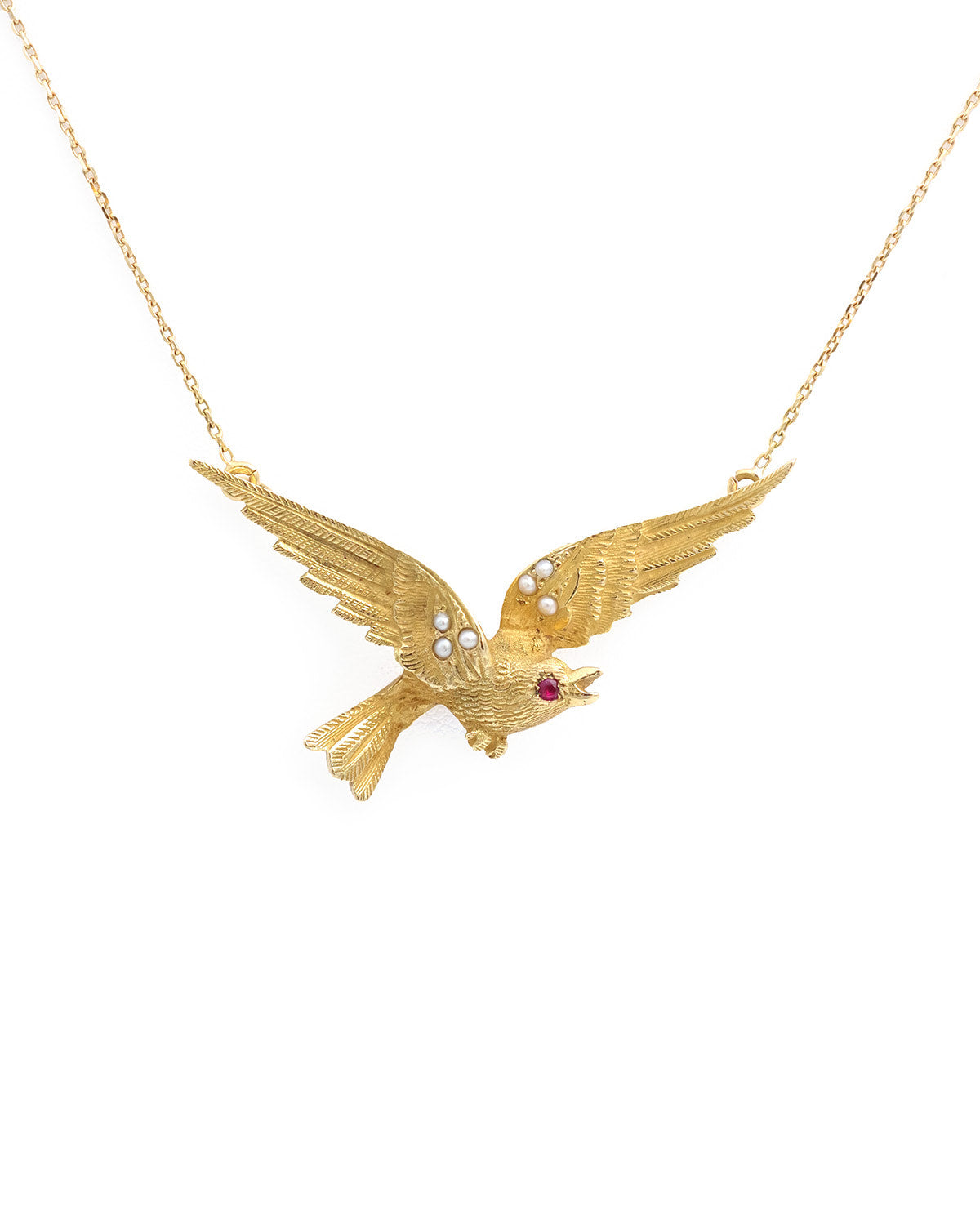 pendentif oiseau en or avec un rubis