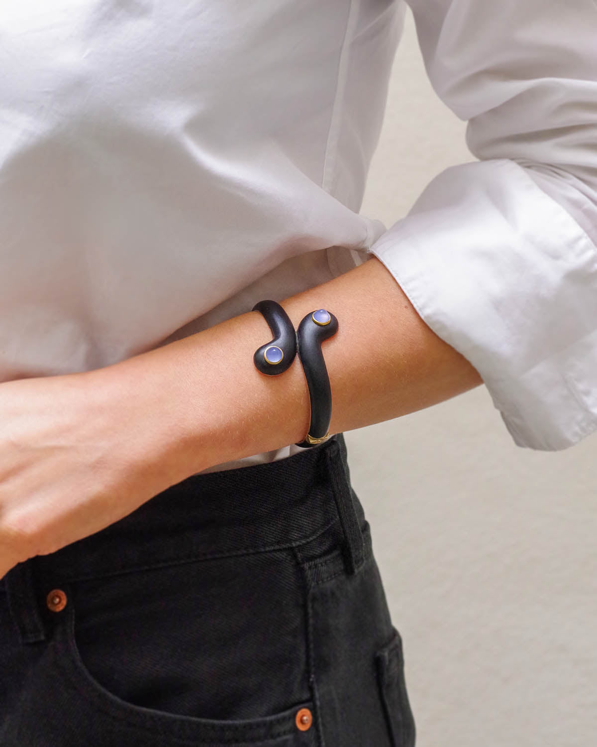 black bracelet in gold