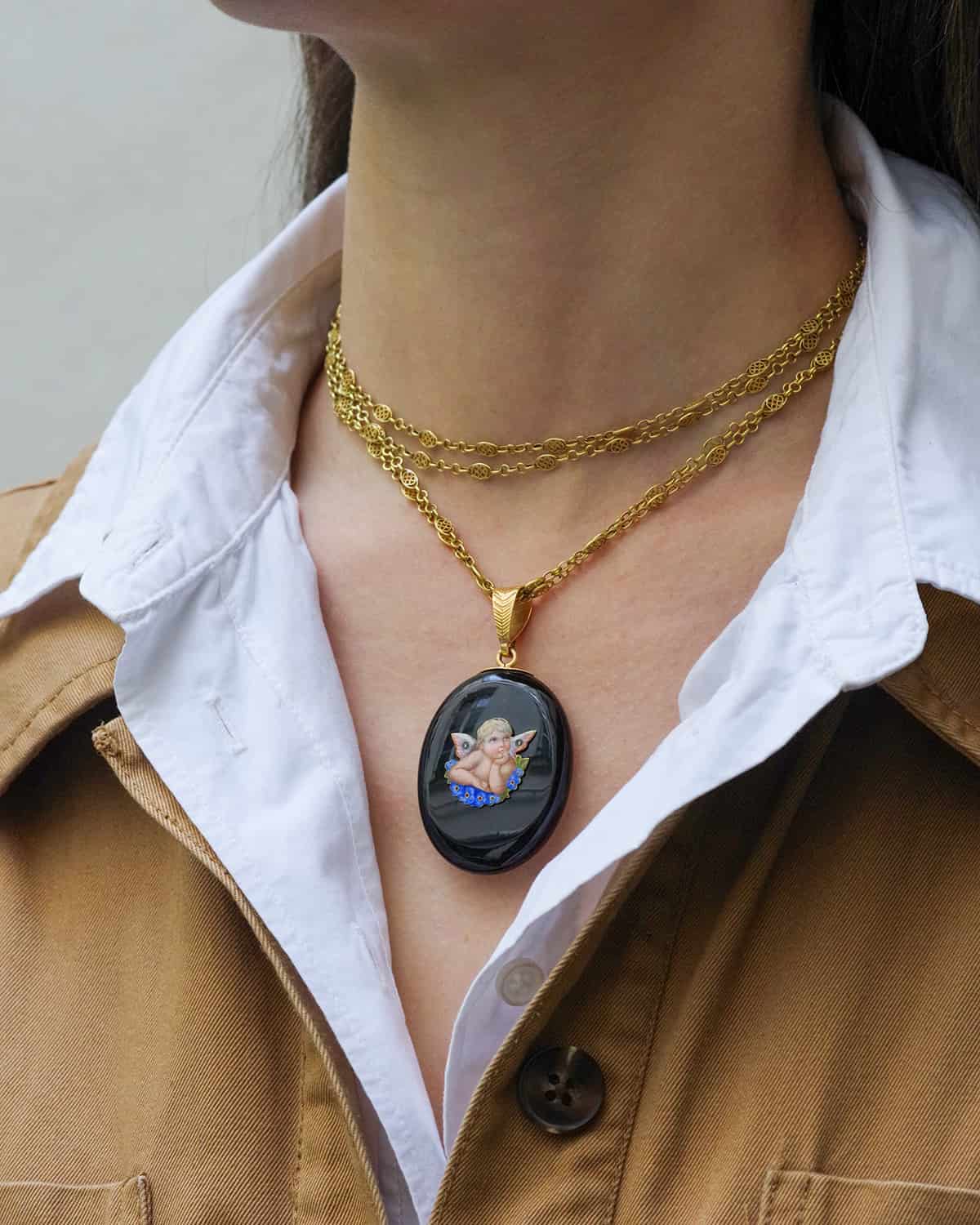 black locket pendant with an angel