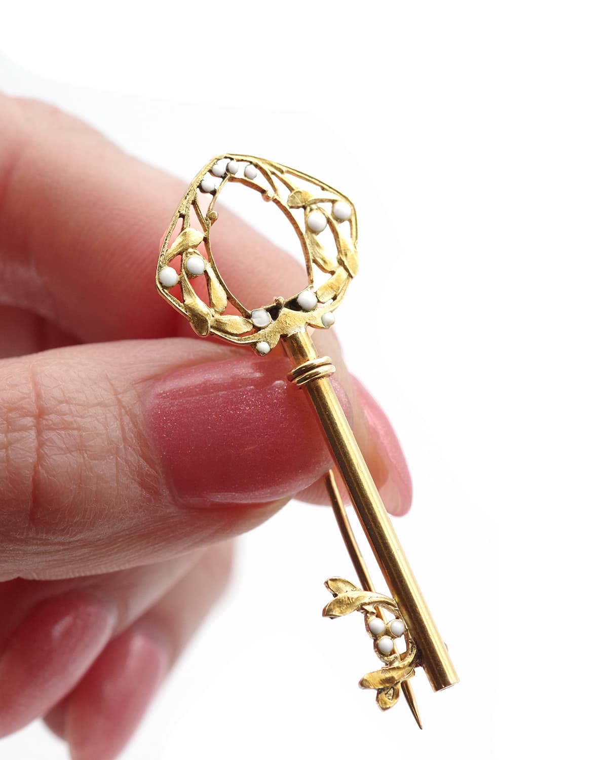 key brooch in gold