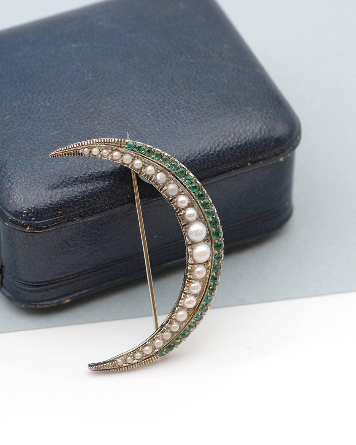 Crescent moon brooch in gold