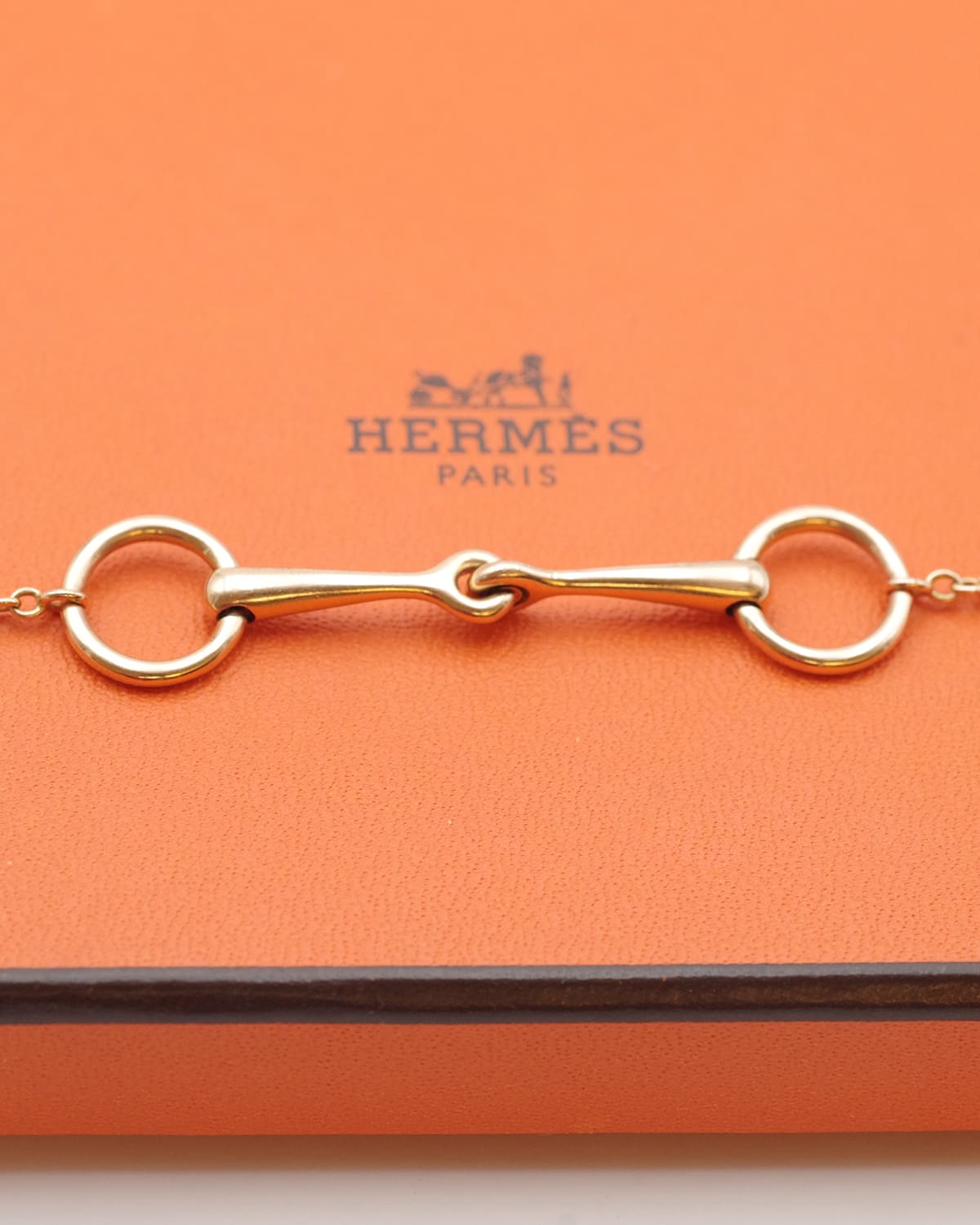 Hermes gold bracelet with a diamond