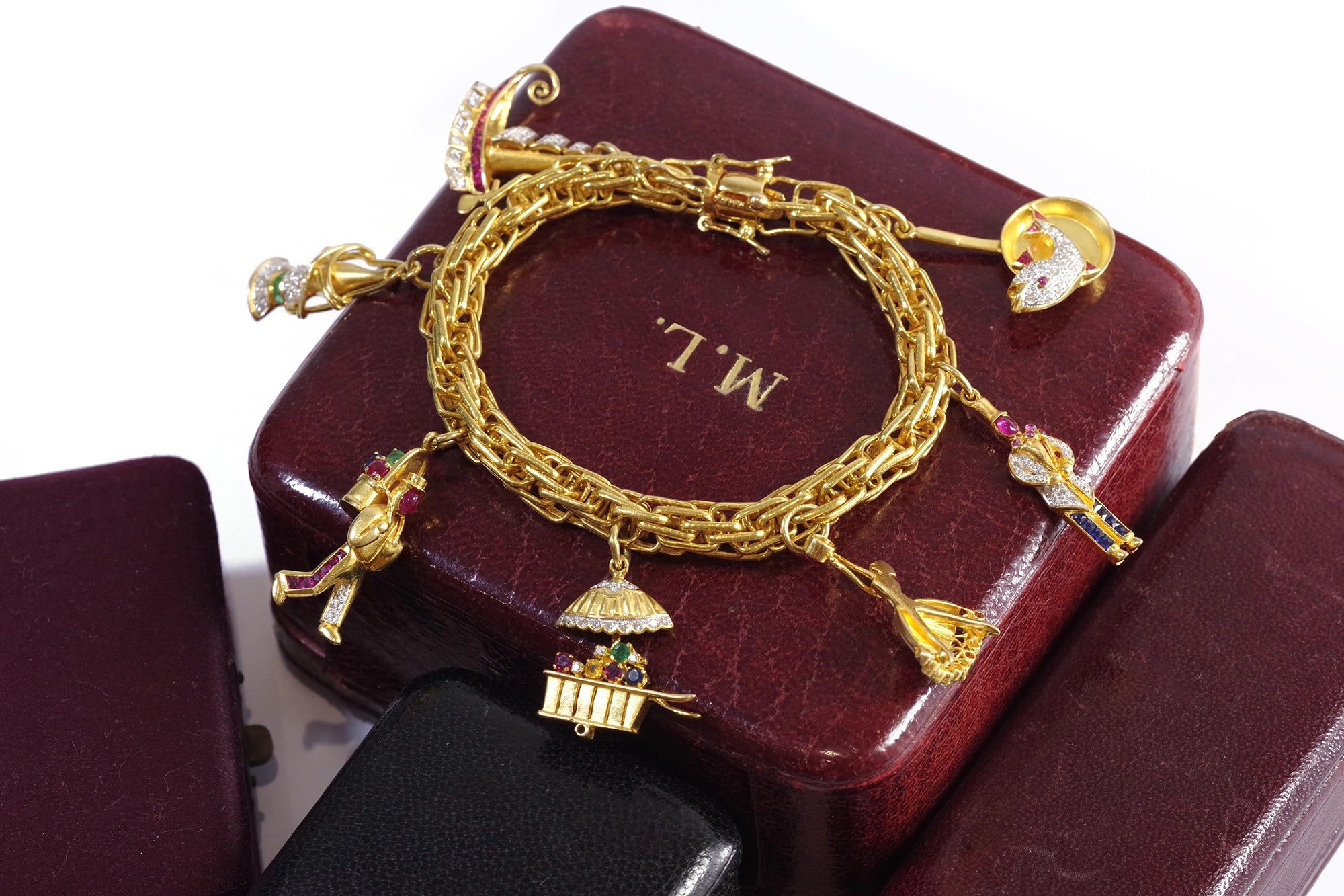 Diamond ruby charms bracelet in gold