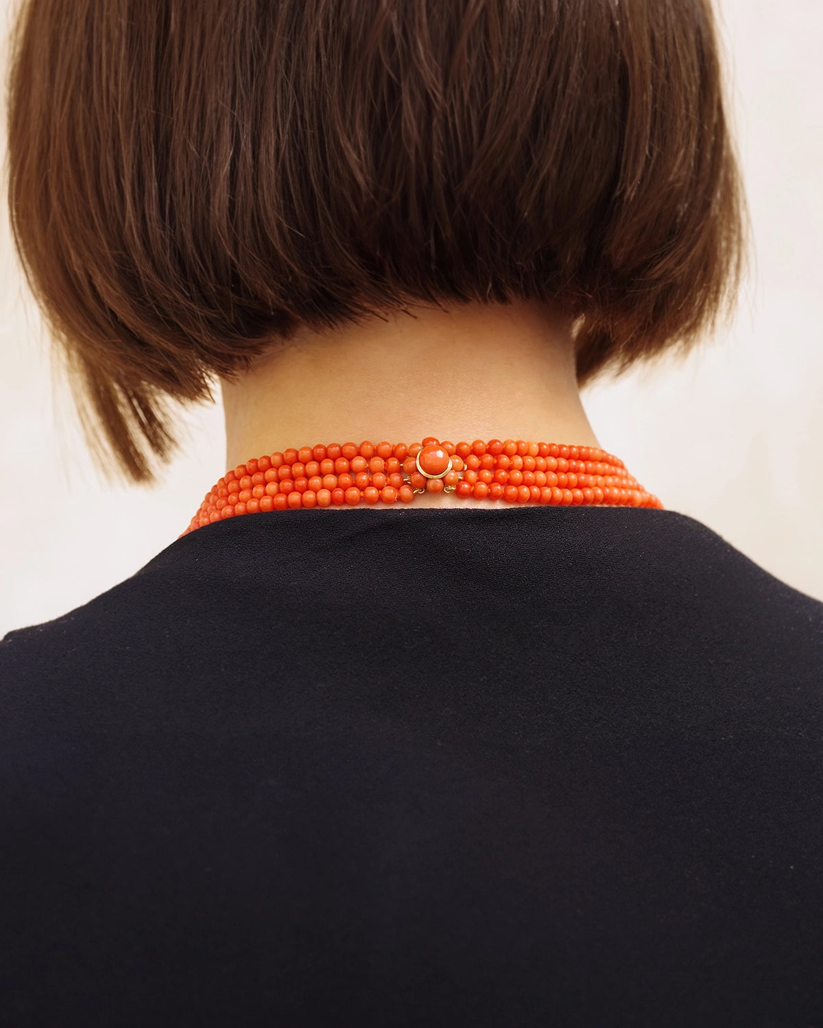 Coral pearls necklace with a gold clasp
