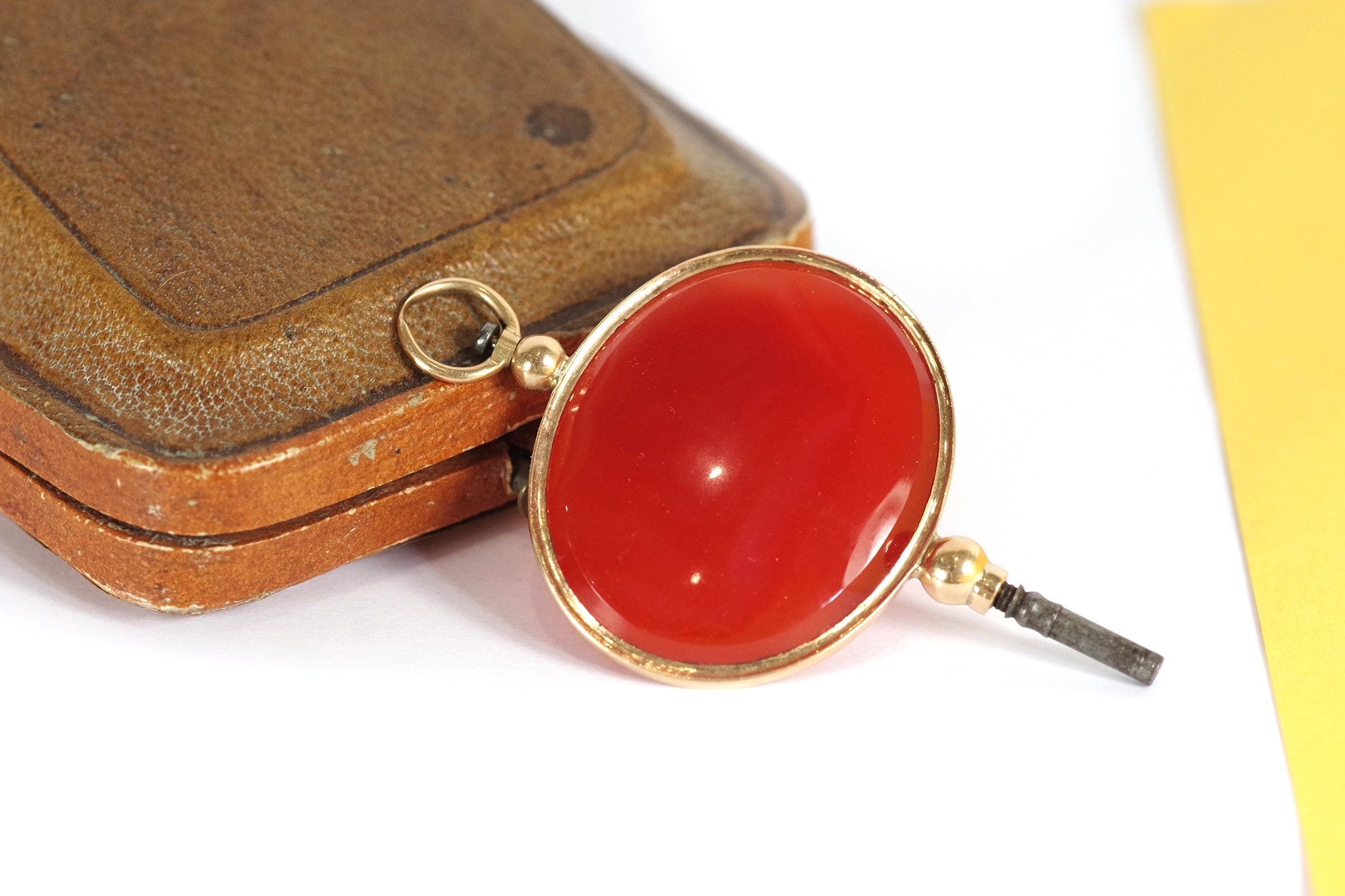 Gold key watch pendant carnelian