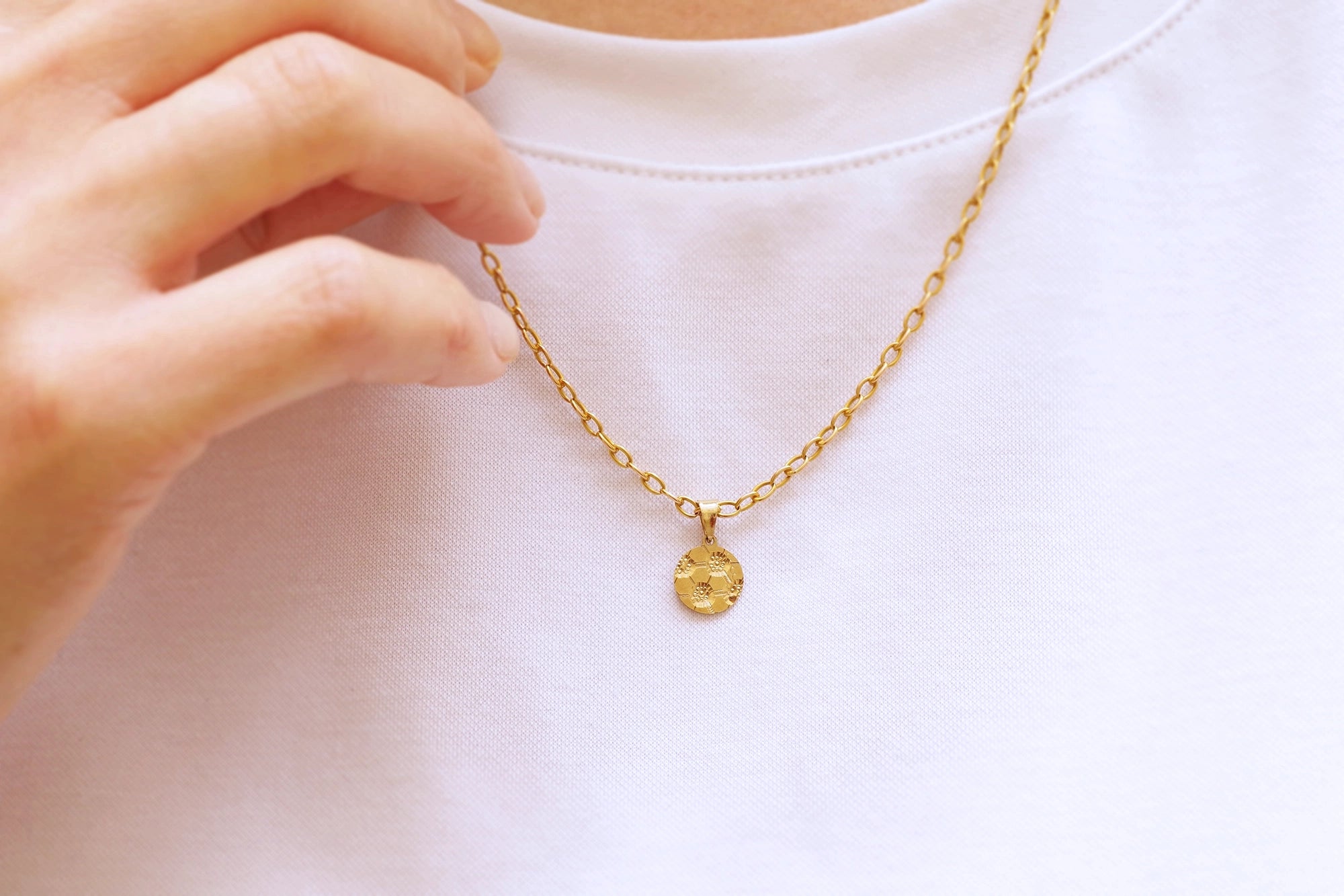 football gold pendant