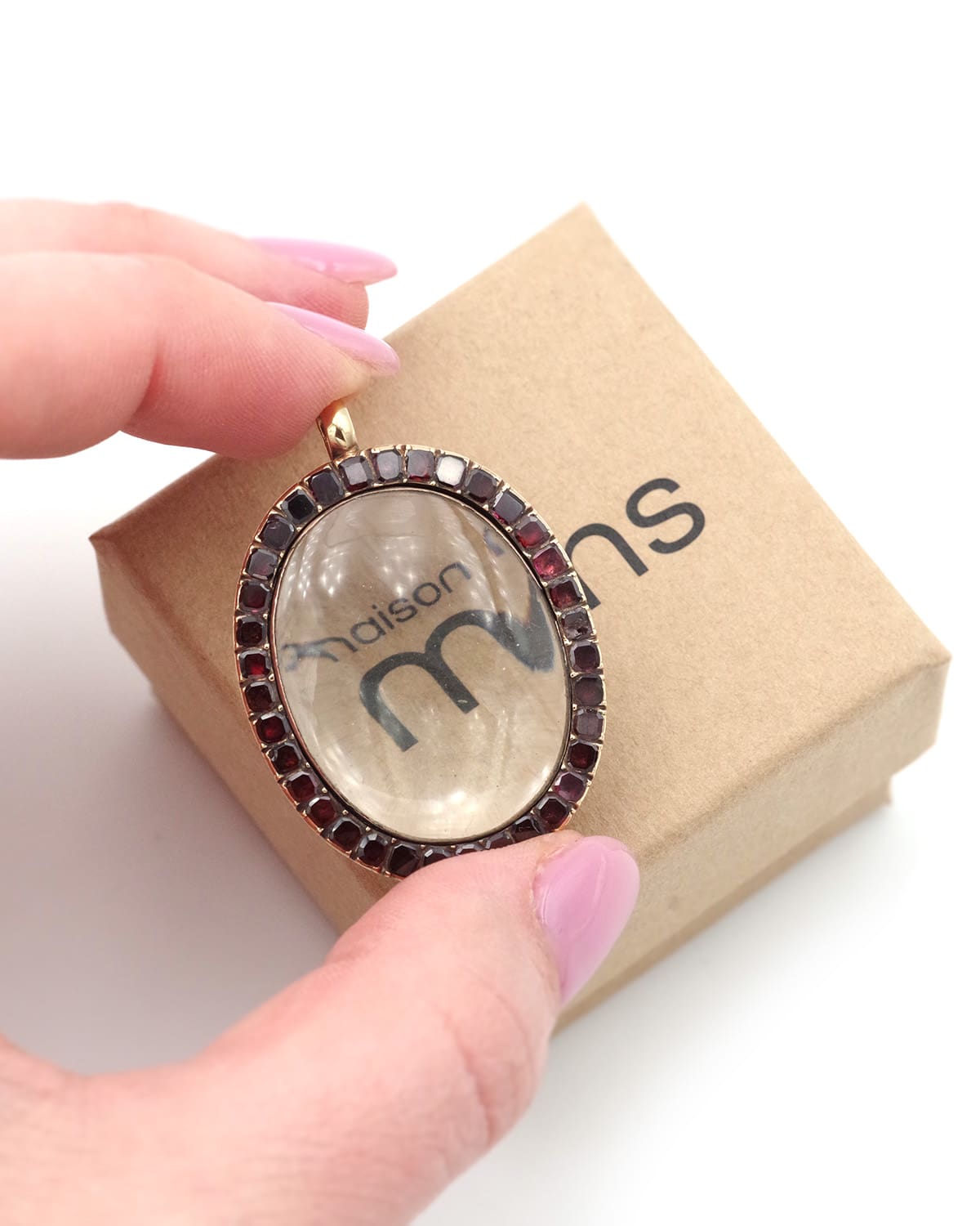 Antique magnifying glass pendant with garnets