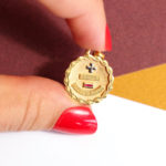 vintage love medal less than today more than tomorrow in gold and rubies