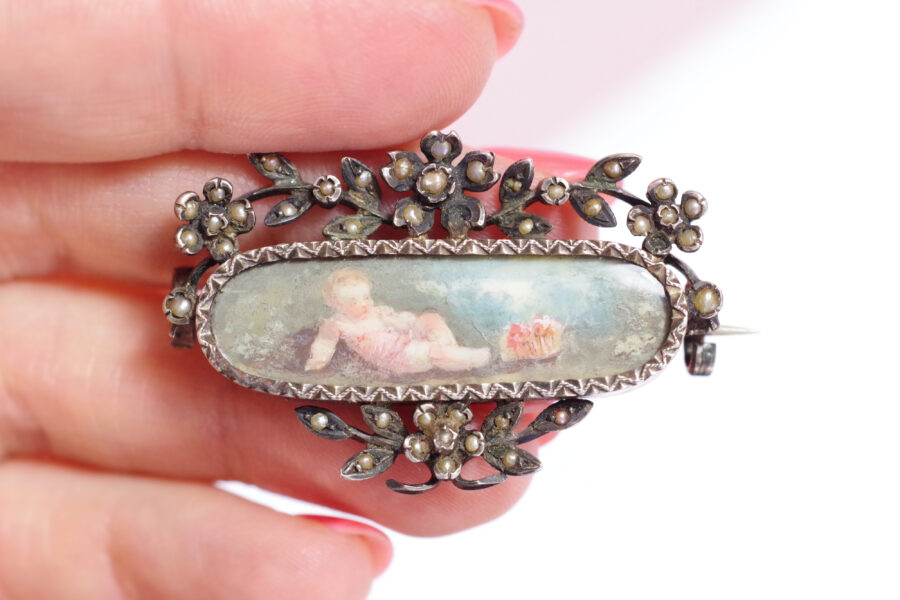 antique putti brooch in silver cupid and cherub