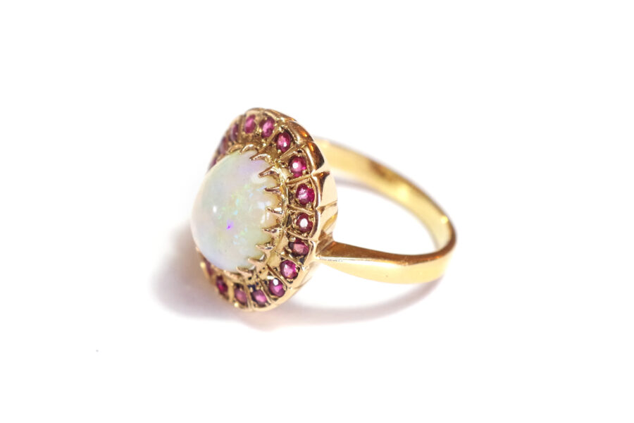 pre-owned ring with a Australian opal and garnet