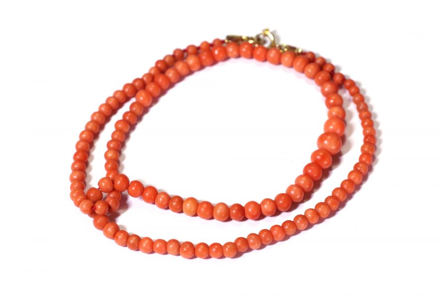 coral pearl necklace with a gold clasp