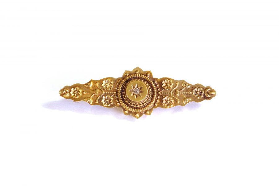 Antique English brooch set with an old cut diamond