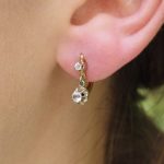 single dangle earrings in gold