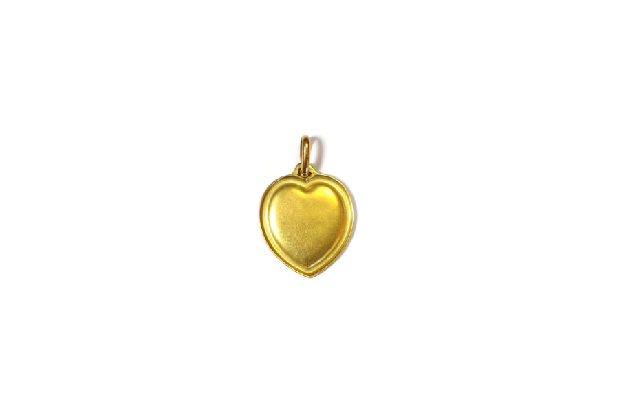 Audis love medal with a heart shaped in gold