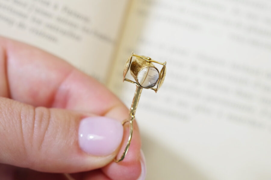 secret magnifying glass pendant in 18k gold