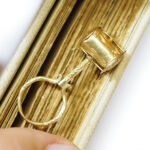 secret magnifying glass pendant in gold