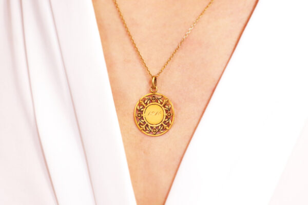 gold flower pendant in gold