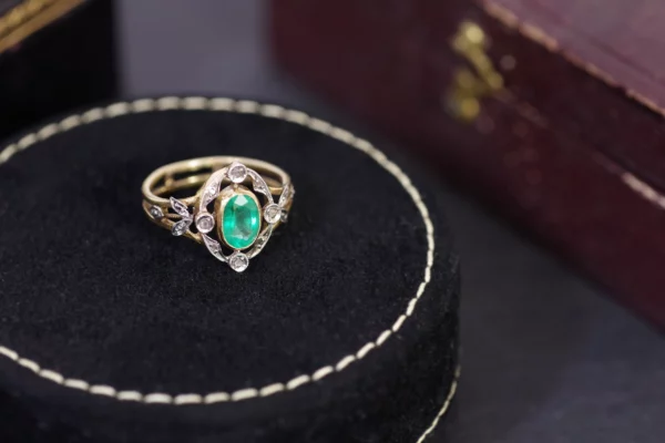 Antique emerald diamond ring in platinum