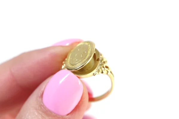 Antique secret locket ring in gold